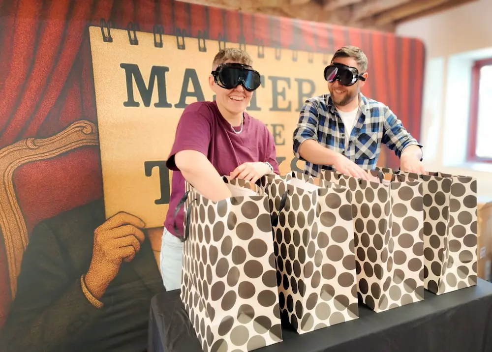 Master of the tasks game people wearing blindfold goggles